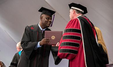 A student receives his diploma.